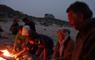 Beachview Cottages (Grandfathers House) group of people around a camp fire on the beach