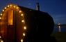 Saltbox Sauna lit at night