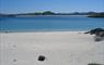 Abhainn Cottage calm beach and blue sky