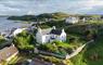 Two Harbours Guest House aerial view of house and sea