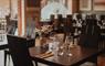 Inside the Cabarfeidh Hotel's Cleaver restaurant  set with tables and chairs.