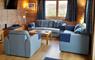 Finsbay Lodges lounge with blue sofas