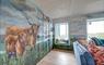 Sea View House highland cow painting on walls