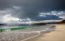 The Croft House beach with dark clouds